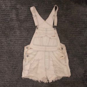 White distressed overall shorts